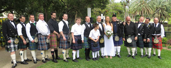 Bride with all the men
                    in kilts - Brisbane Botanic Gardens, Jennifer Cram,
                    Brisbane Wedding Celebrant